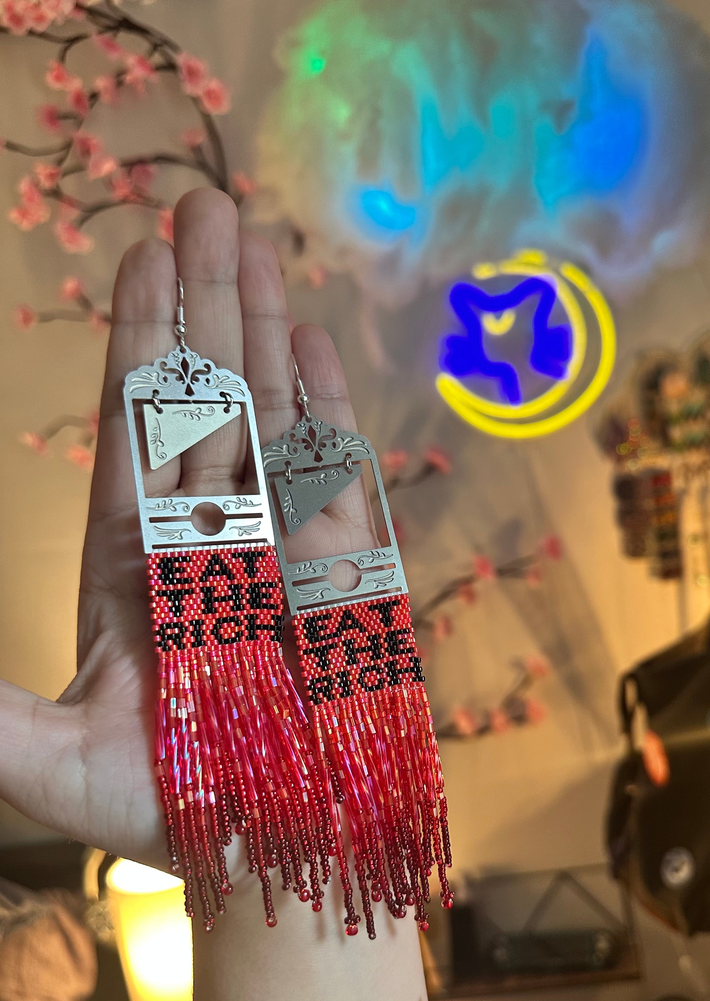 Eat the rich beaded guillotine earrings